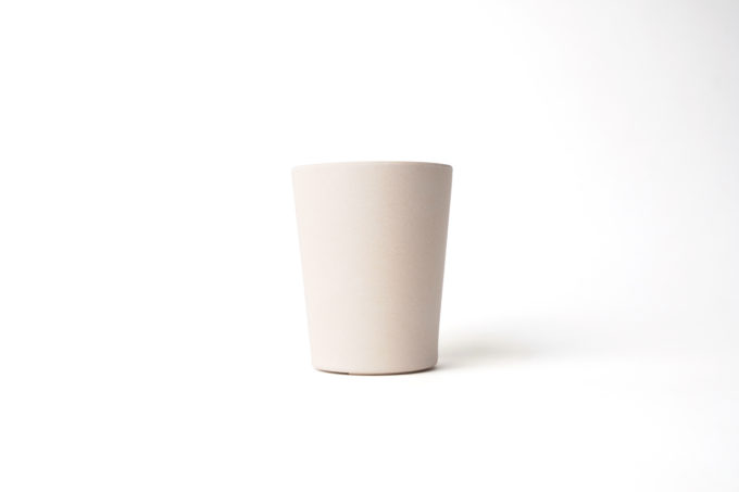 Reusable beige cup (330ml) made from bamboo.