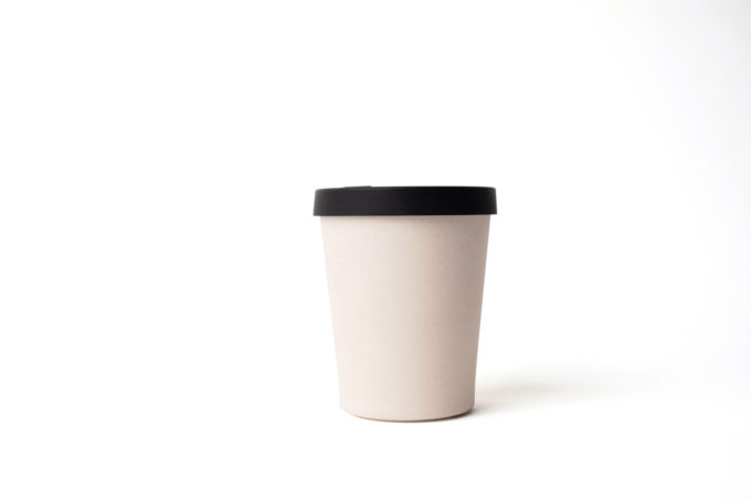 Reusable beige cup (330ml) made from bamboo with black silicon lid.