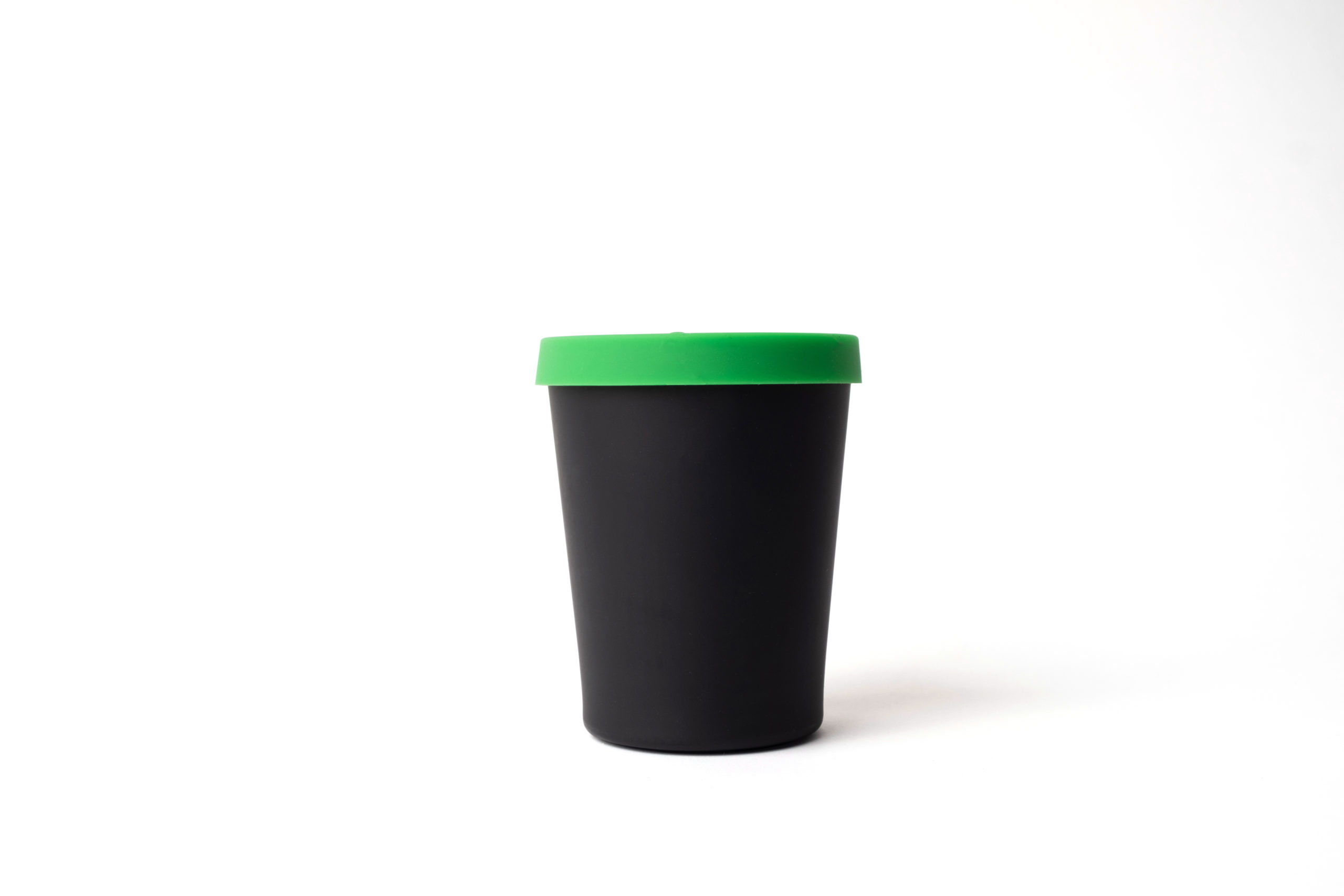 Reusable black cup (330ml) made from bamboo with green silicon lid.