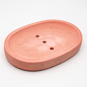 Terracota Soapdish Cannes Av des Coteaux, oval shape with thee draining holes, handmade in Berlin by Kula.