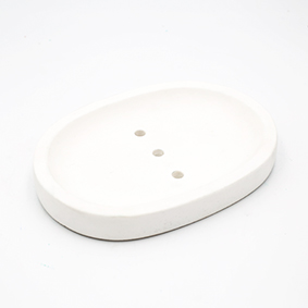 Soapdish Cannes rue du près white color, oval shape with three draining holes, handmade in Berlin by Kula.