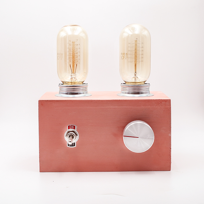 RADIO LAMP Abricot made with porcelaine clay, two bulbs and a silver dimming button.